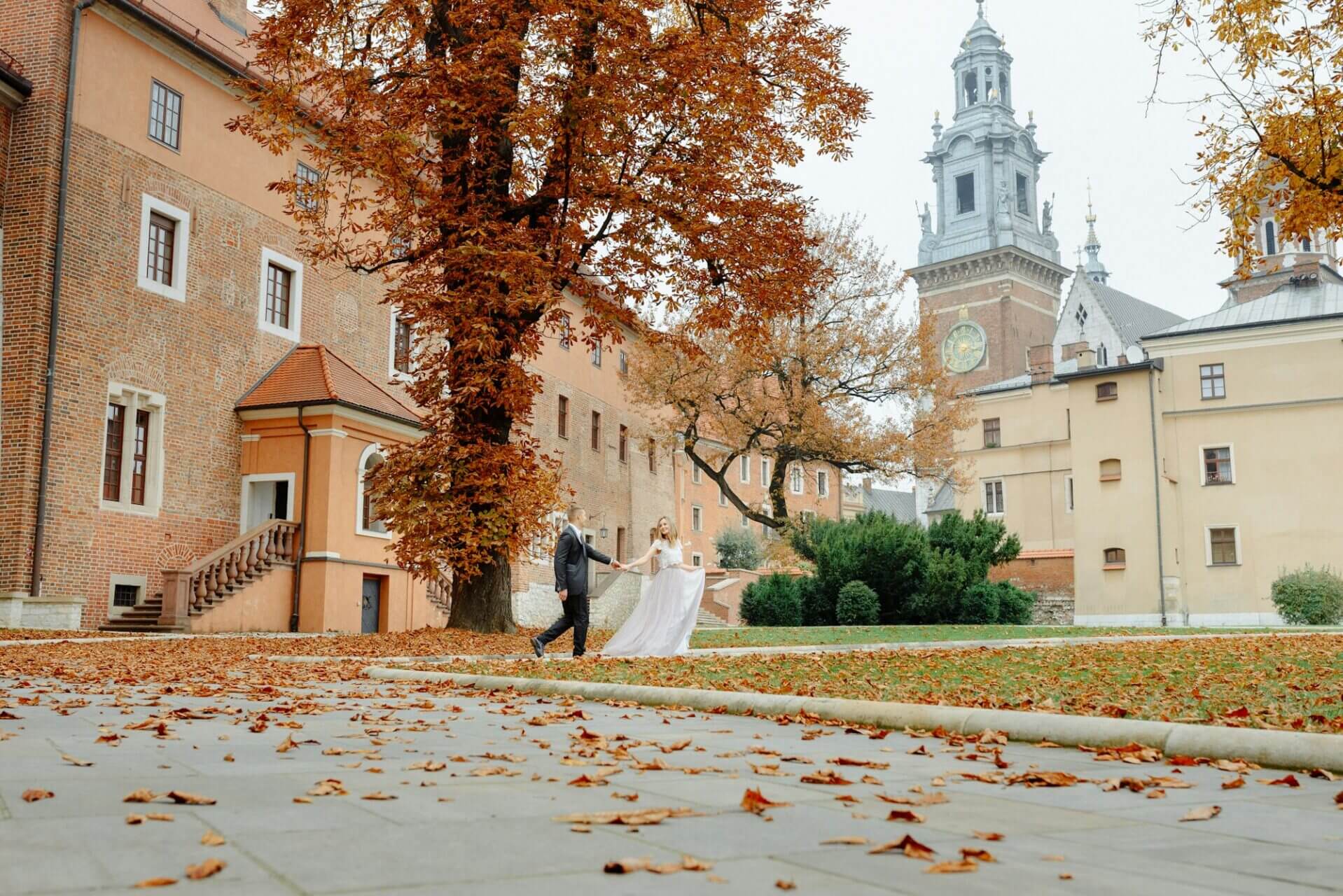 Two lovers walk along Krakow
